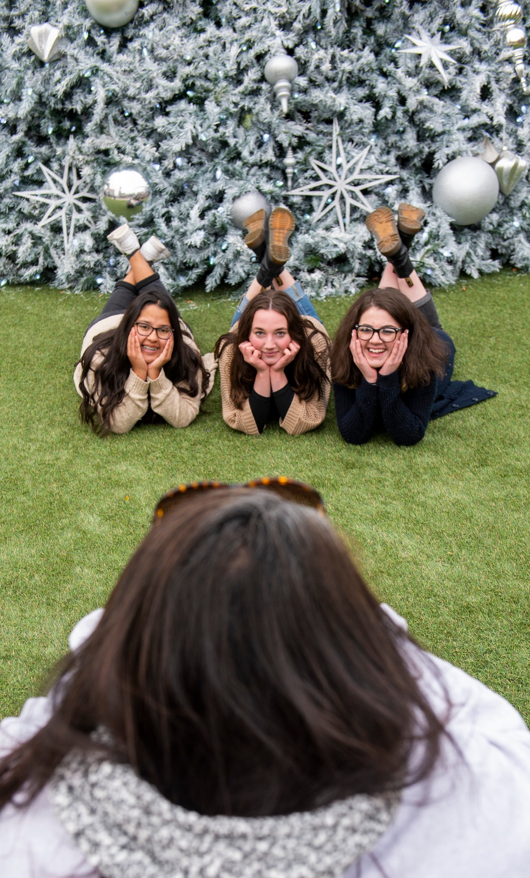 (Rick Egan  |  The Salt Lake Tribune)       Angelique Duran, Emma Robertson and Abby McCoy pose for a photo in front to the Christmas Tree, during the second annual Made in Utah Winter Fest at The Gateway.  The free festival includes local artists, musicians, artisans, breweries, distilleries, food trucks, and other local businesses, to help promote shopping locally for holidays. The Utah Winter Fest continues December 21 & 22. Sunday, Dec. 15, 2019.
