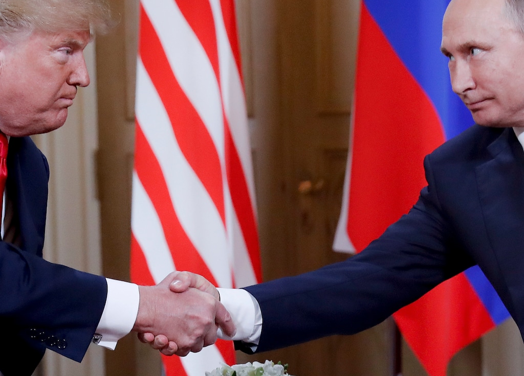 FILE - In this Monday, July 16, 2018 file photo, U.S. President Donald Trump, left, and Russian President Vladimir Putin, right, shake hand at the beginning of a meeting at the Presidential Palace in Helsinki, Finland. Throughout 2018, special cnvestigator Robert Mueller’s team investigated whether Trump's campaign colluded with Russia ahead of the 2016 election and whether the president obstructed the investigation. (AP Photo/Pablo Martinez Monsivais)