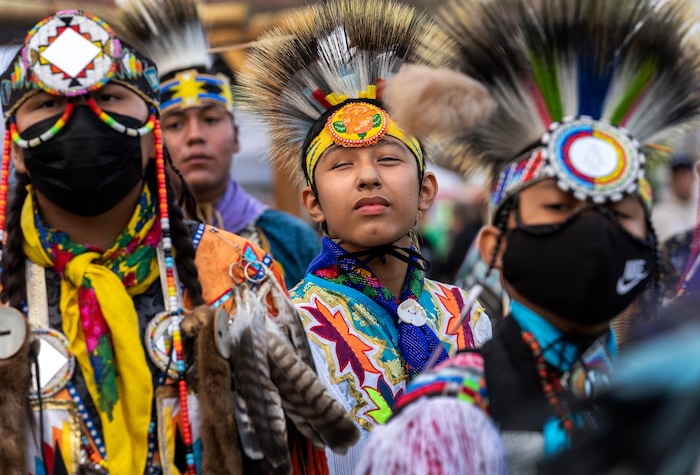 (Leah Hogsten | The Salt Lake Tribune Young men from Native American tribes throughout the West show their regalia during the Grand Entry at the 41st Annual Paiute Indian Tribe of Utah Restoration Gathering, Aug. 13, 2021 in Cedar City, Utah.