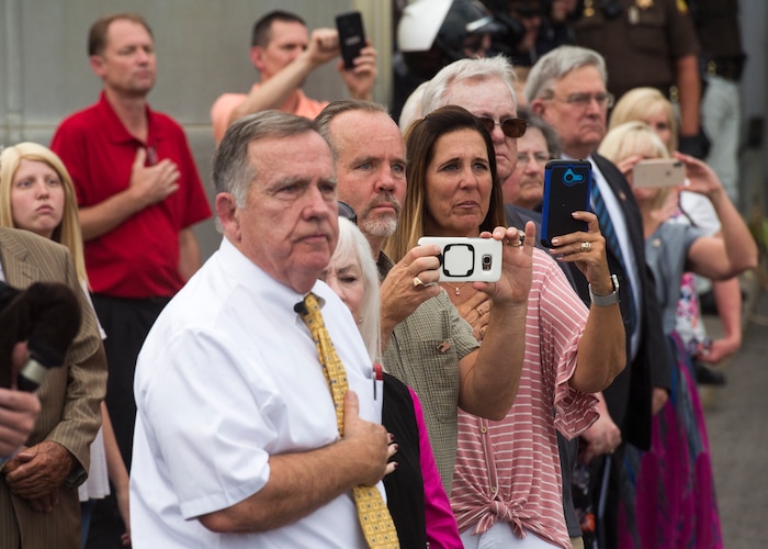 (Rick Egan  |  The Salt Lake Tribune)      Relatives watch as the remains of Marine Pfc. Robert K. Holmes are carried from the Delta Air Cargo to a hearse for transportation to the mortuary.  Holmes died aboard the USS Oklahoma during the attack on Pearl Harbor. Friday, Aug. 17, 2018.