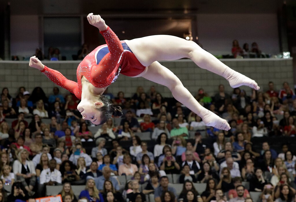 Aly Raisman competes on the balance beam during the women's U.S. Olympic gymnastics trials in San Jose, Calif., Friday, July 8, 2016. (AP Photo/Gregory Bull)