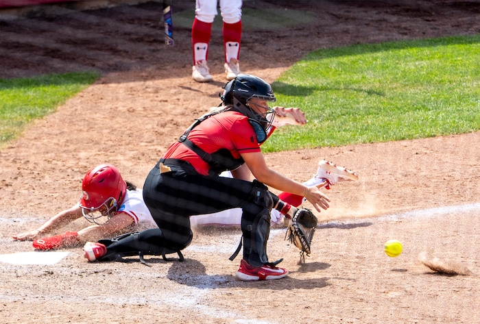 (Rick Egan | The Salt Lake Tribune)  Haley Denning beats the throw to score for Utah, in NCAA Softball Super Regionals action between the Utah Utes and the San Diego State Aztecs, on Saturday, May 27, 2023.
