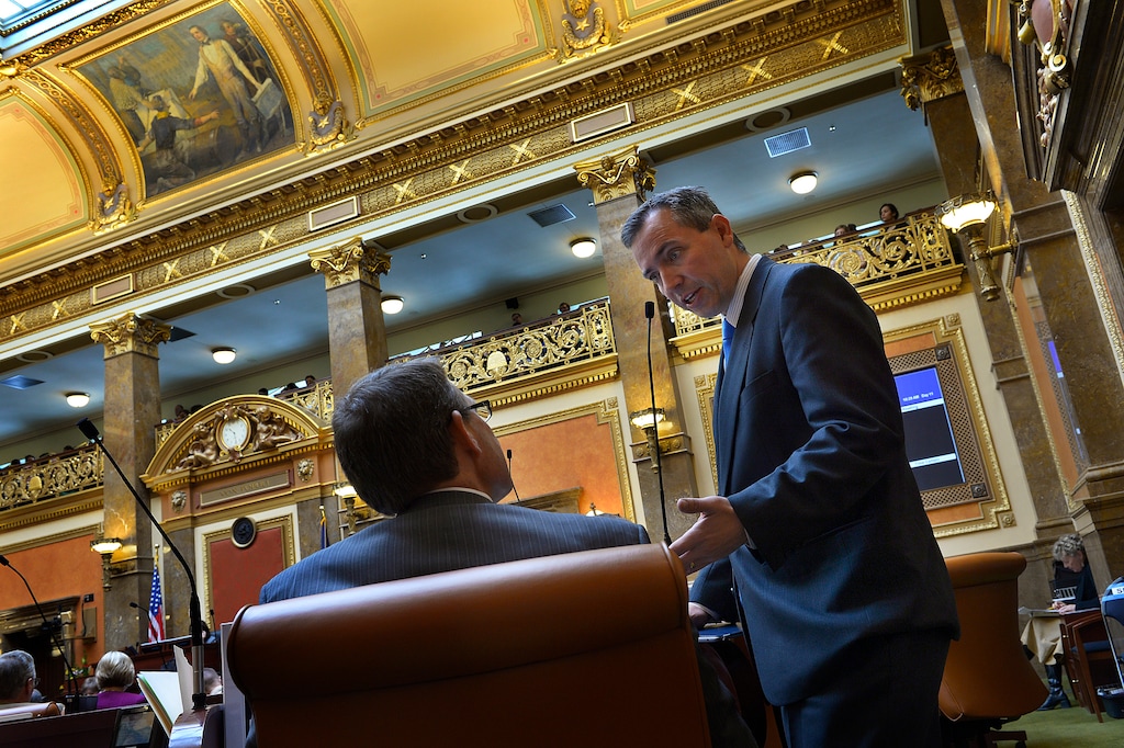 (Scott Sommerdorf   |  Tribune file photo) Rep. Dan McCay, R-Riverton, speaks with Rep. Brad Last, R-Hurricane, on the floor of the House of Representatives, Feb. 6, 2014. McCay last November was elected to the state Senate.
