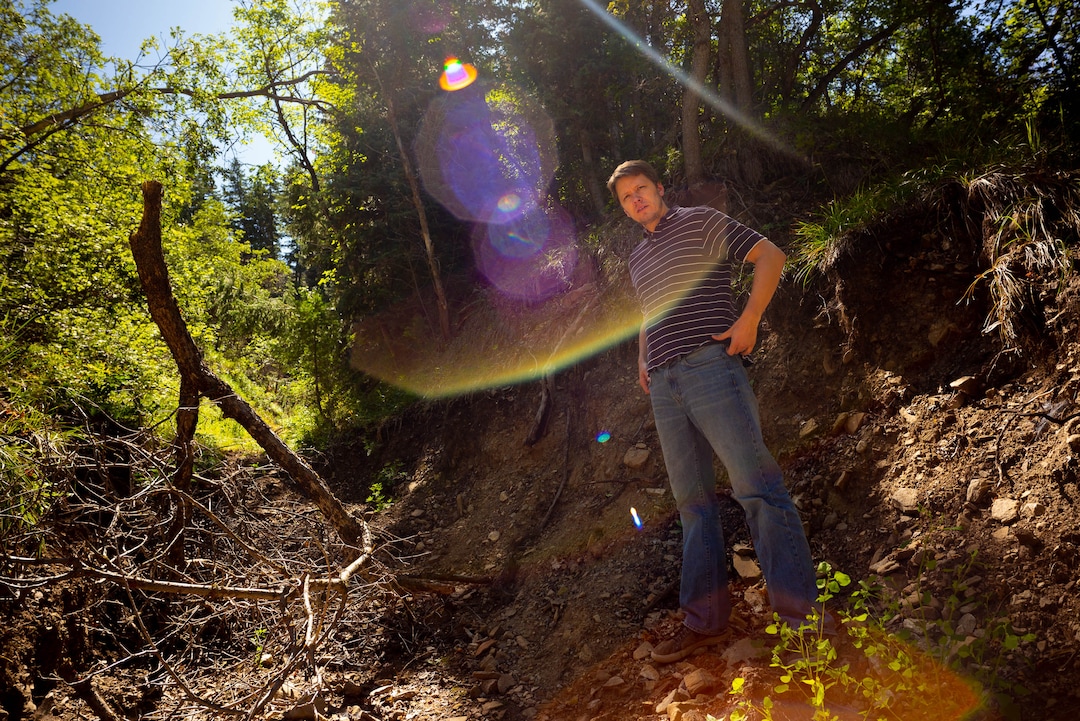 (Trent Nelson  |  The Salt Lake Tribune)  Kirk Richards stands in a diversion ditch near his Woodland Hills home on Thursday Aug. 15, 2019.