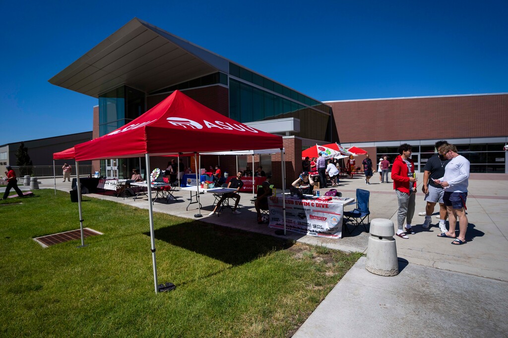 (Rick Egan | The Salt Lake Tribune) Games and booths are set up creating a party atmosphere, at the Spence and Cleone Eccles Football Center for those getting the Covid-19 at the Vaccination clinic at the University of Utah, Tuesday, June 29, 2021.