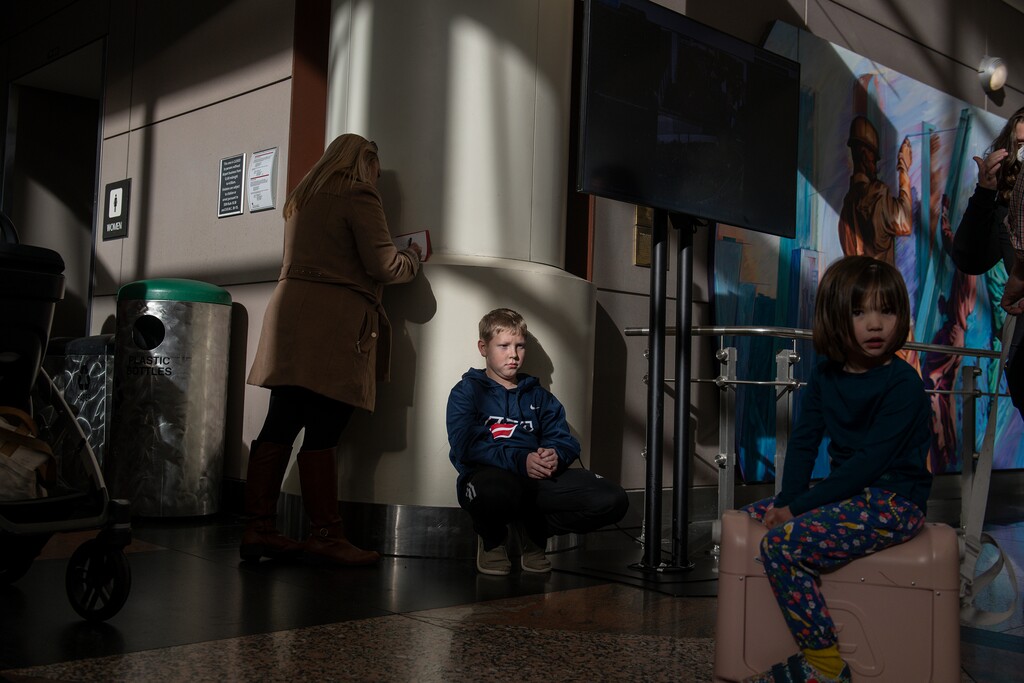 (Daniel Brenner For The New York Times)

A family waits to get on a flight at the Denver International Airport on Dec. 27. Disruptions caused Southwest Airlines to alter about 60 percent of its flights.