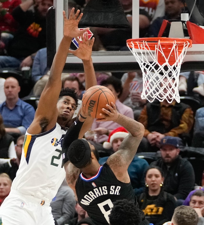 (Francisco Kjolseth | The Salt Lake Tribune) Utah Jazz center Hassan Whiteside (21) puts the block on LA Clippers forward Marcus Morris Sr. (8) in NBA action between the Utah Jazz and the LA Clippers at Vivint Smart Home Arena in Salt Lake City, Wednesday, Dec. 15, 2021.