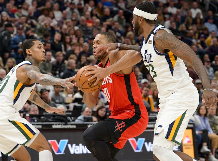 (Leah Hogsten  |  The Salt Lake Tribune)  Utah Jazz guard Jordan Clarkson (00) and Utah Jazz forward Royce O'Neale (23) pressure Houston Rockets guard Eric Gordon (10). The Utah Jazz lost to the Houston Rockets 110-120 at Vivint Arena, Feb. 22, 2020.