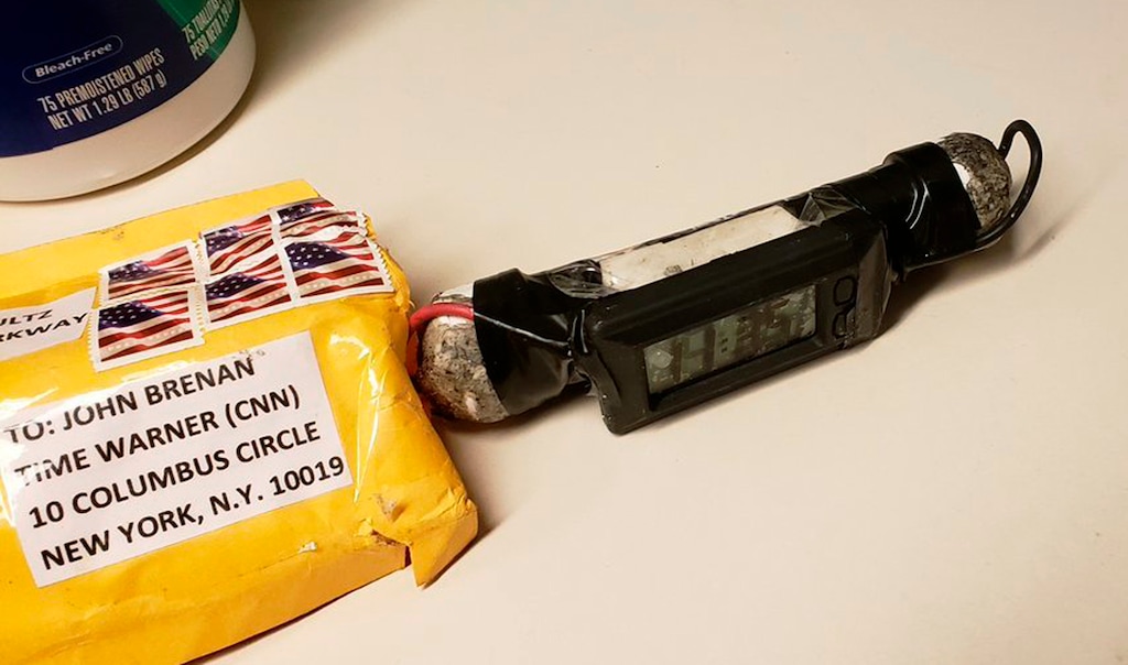 (ABC News | The Associated Press) This image obtained Wednesday, Oct. 24, 2018, and provided by ABC News shows a package addressed to former CIA head John Brennan and an explosive device that was sent to CNN's New York office. The mail-bomb scare widened Thursday as law enforcement officials seized more suspicious packages.