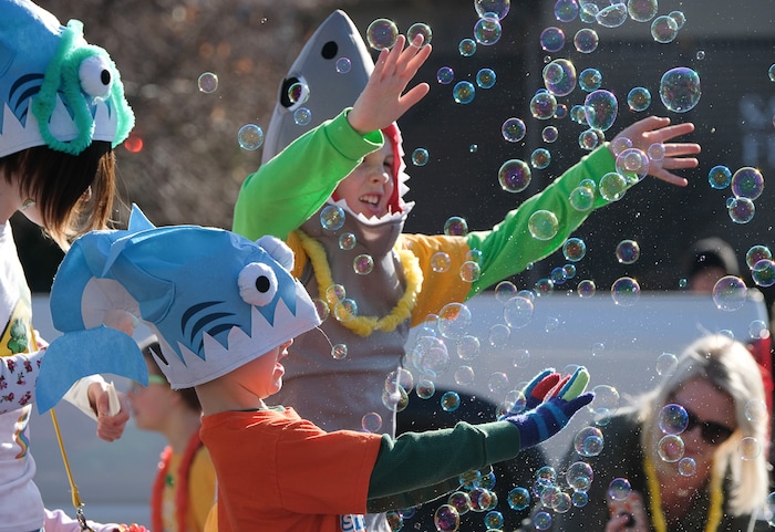 (Francisco Kjolseth | The Salt Lake Tribune) Members of the Gold Fish Swim School have a little fun with bubbles during the 41st annual St. PatrickÕs Day Parade in Salt Lake City on Saturday, March 16, 2019.