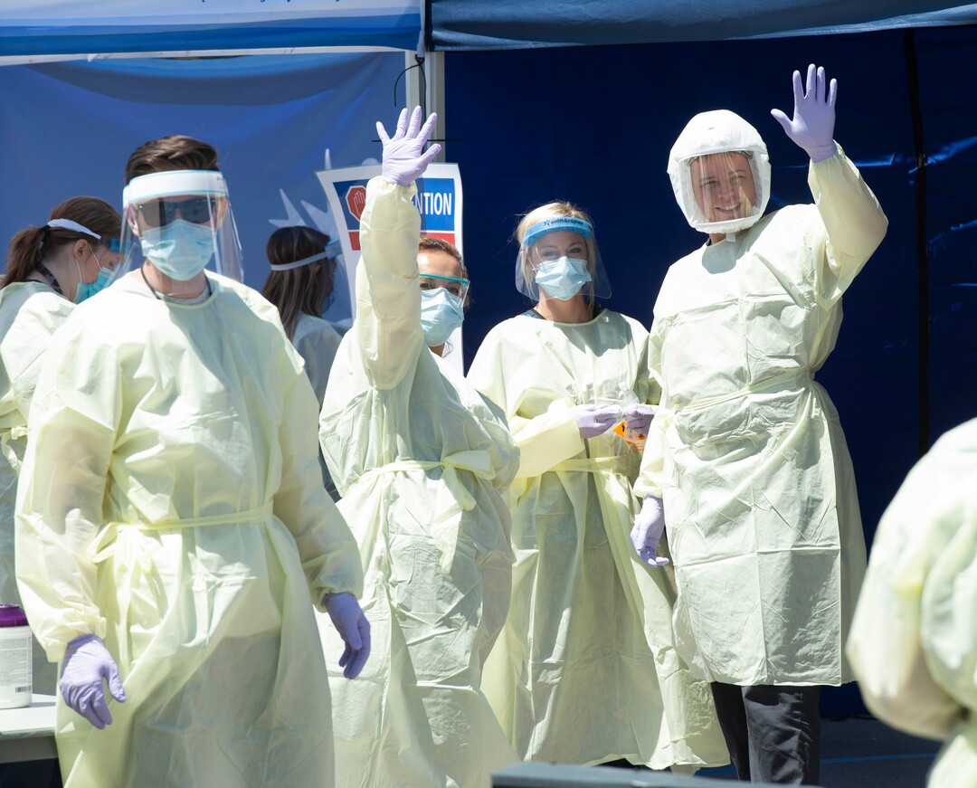 (Rick Egan  |  The Salt Lake Tribune)   Medical assists motion that they are ready for the next patient, at the Intermountain Healthcare Coronavirus Mobile Testing Unit at Utah Valley Hospital in Provo, Friday May 8, 2020.