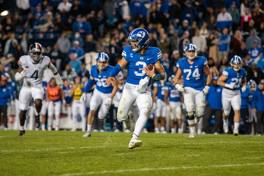 (Trevor Christensen | Special to The Tribune) Brigham Young University's Jaren Hall runs the ball against Virginia during the second half at LaVell Edwards Stadium on Saturday, Oct. 30, 2021, in Provo.