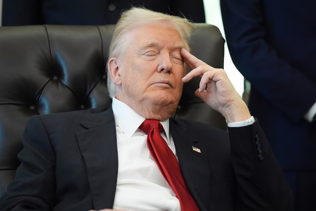 President Donald Trump listens as Health and Human Services Secretary Robert F. Kennedy Jr. speaks on Thursday, Nov. 6, 2025, in the Oval Office of the White House in Washington. (AP Photo/Evan Vucci)