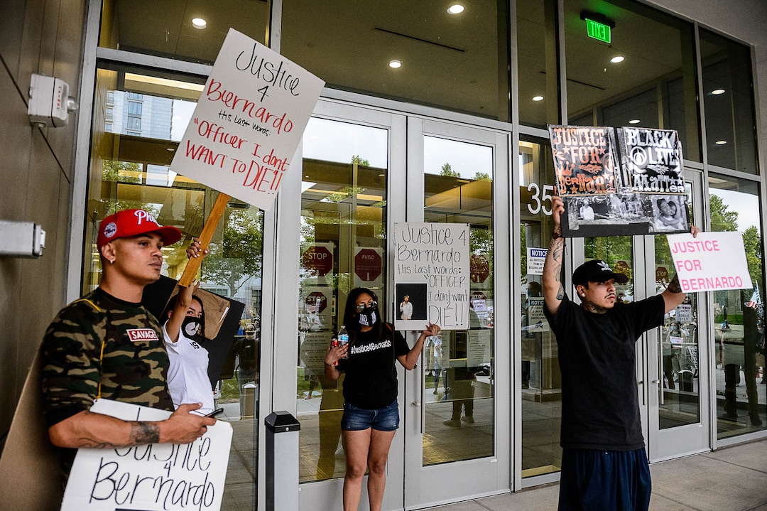 (Trent Nelson  |  The Salt Lake Tribune) People gather at the Salt Lake County District Attorney's office to protest against police brutality in Salt Lake City on Saturday, June 13, 2020.