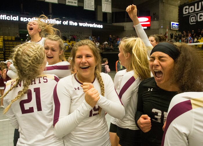 (Rick Egan  |  The Salt Lake Tribune)    The Lone Peak Knights celebrate their win over the Pleasant Grove Vikings, for the 6A volleyball championship, at Utah Valley University, Saturday, November 4, 2017.