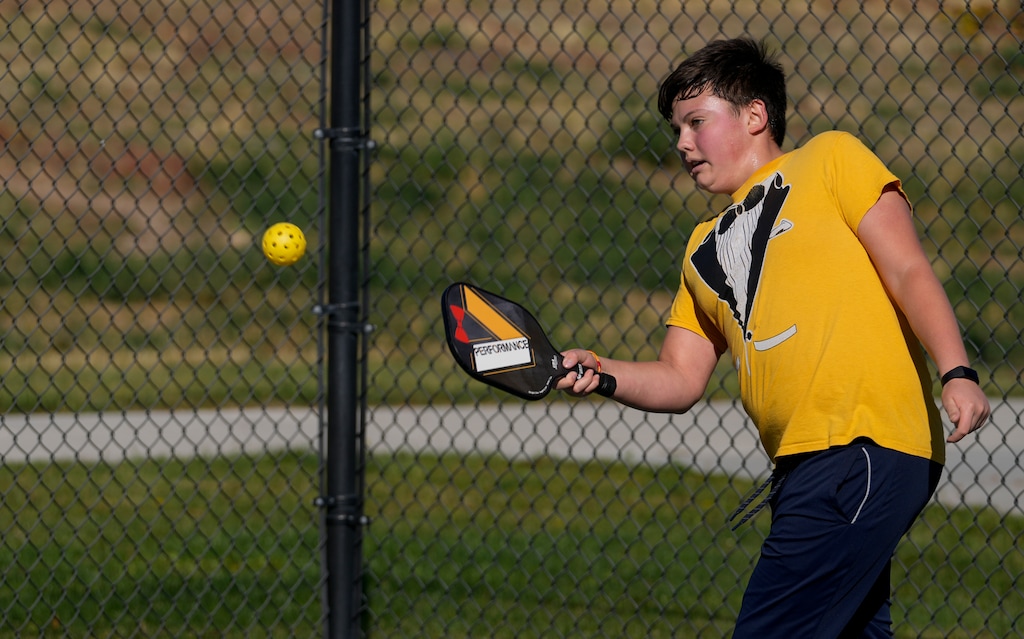 (Bethany Baker  |  The Salt Lake Tribune) Oliver Loubet plays pickleball with his family at Lodestone Park in Kearns on Friday, Oct. 13, 2023. Loubet must carry two inhalers with him at all times, to deal with breathing problems exacerbated by the west side's air quality problems.