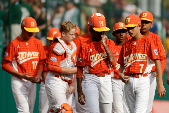 Lufkin, Texas' Zach Phipps (5) walks the field with his teammates after losing the Little League World Series Championship baseball game to Japan, Sunday, Aug. 27, 2017, in South Williamsport, Pa. (AP Photo/Matt Slocum)