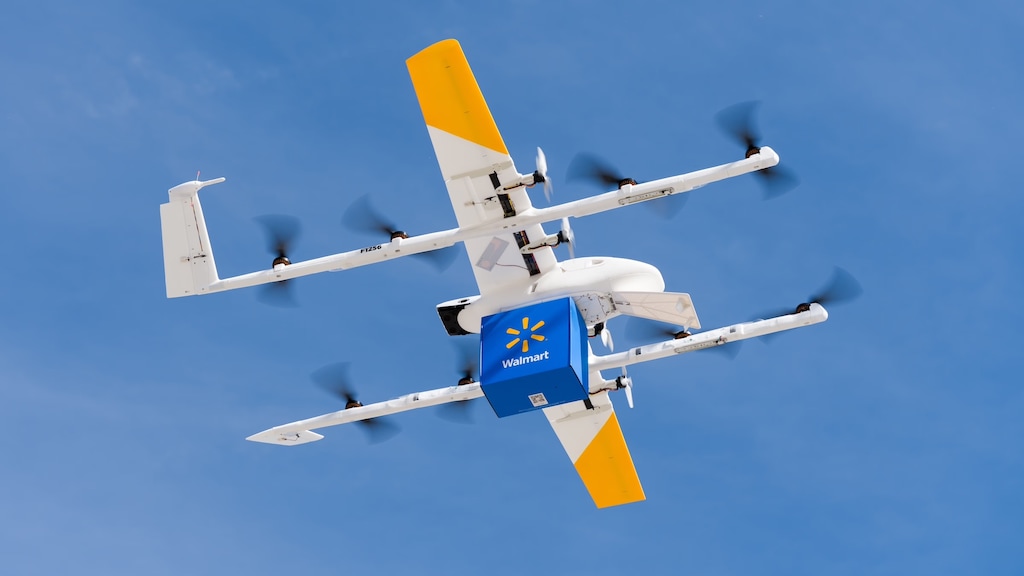 (Wing) A Wing delivery drone loaded with a Walmart package.