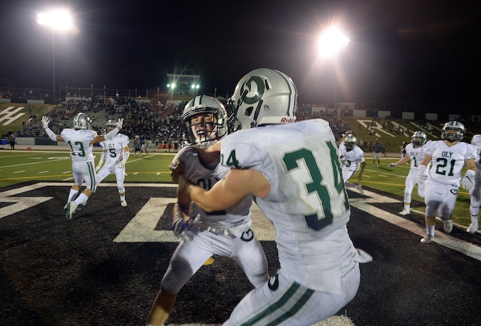 (Scott Sommerdorf   |  The Salt Lake Tribune)  Olympus players stream onto the field after stopping Highland to end the game. Olympus defeated Highland 5-3 in a defensive battle at Highland, Friday, August 26, 2016.