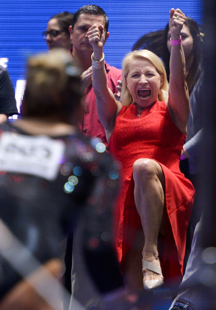 (Leah Hogsten  |  The Salt Lake Tribune)   Red Rocks head coach Megan Marsden celebrates the bars routine of Tiffani Lewis. The fourth-ranked Utes compete against No. 9 California, No. 16 Auburn, No. 21 Brigham Young, Stanford and Southern Utah, during the the NCAA Regional Championships, Saturday, April 7, 2018 at the Huntsman Center. The top two teams advance to the NCAA Championships April 20-21 in St. Louis.