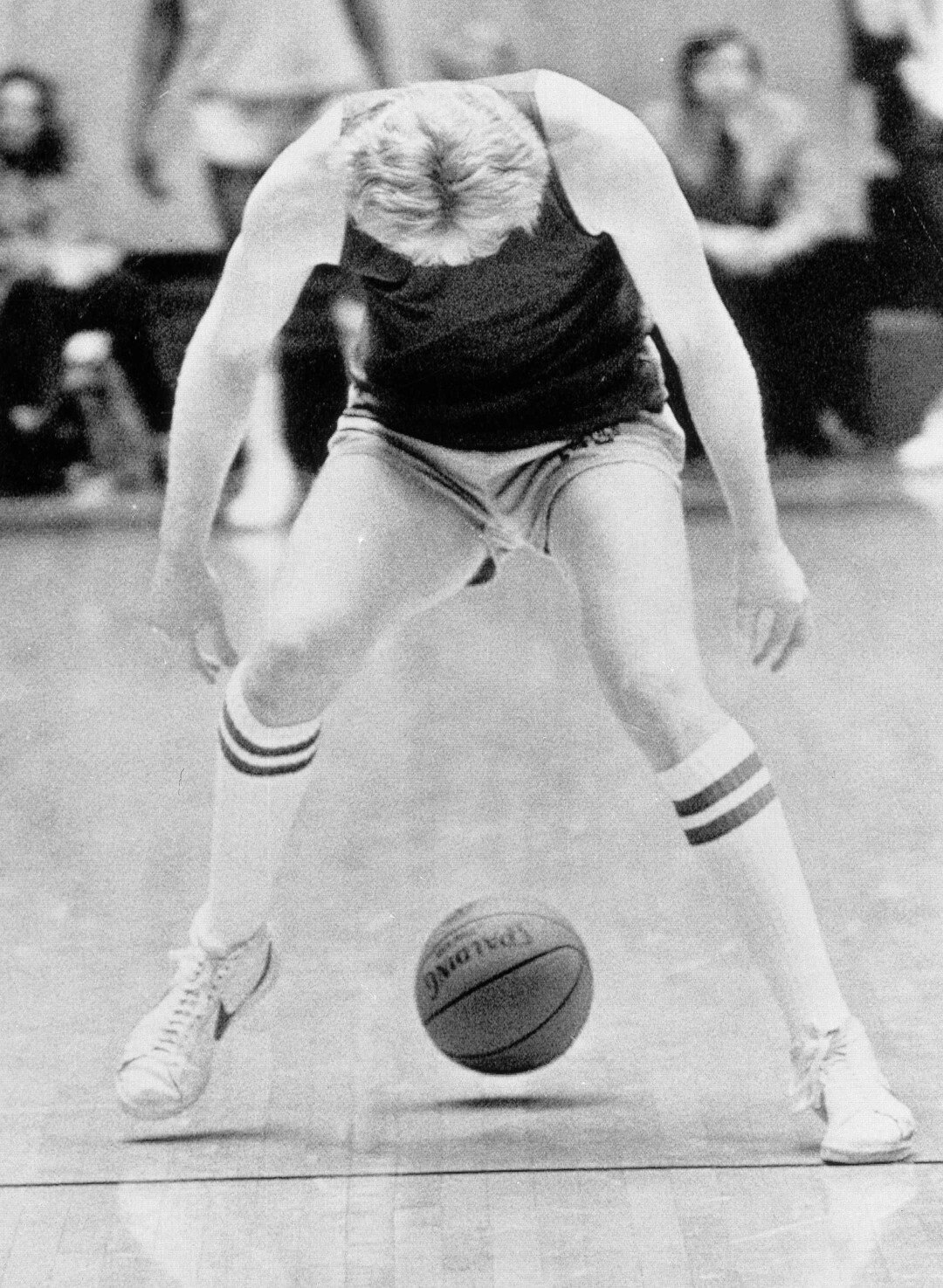 (AP Photo) Indiana State's Larry Bird hovers over the ball during a dribble drill as the Sycamores worked out, Thursday, March 23, 1979 in Salt Lake City. They will meet De Paul in semi-finals of the NCAA tournament. 