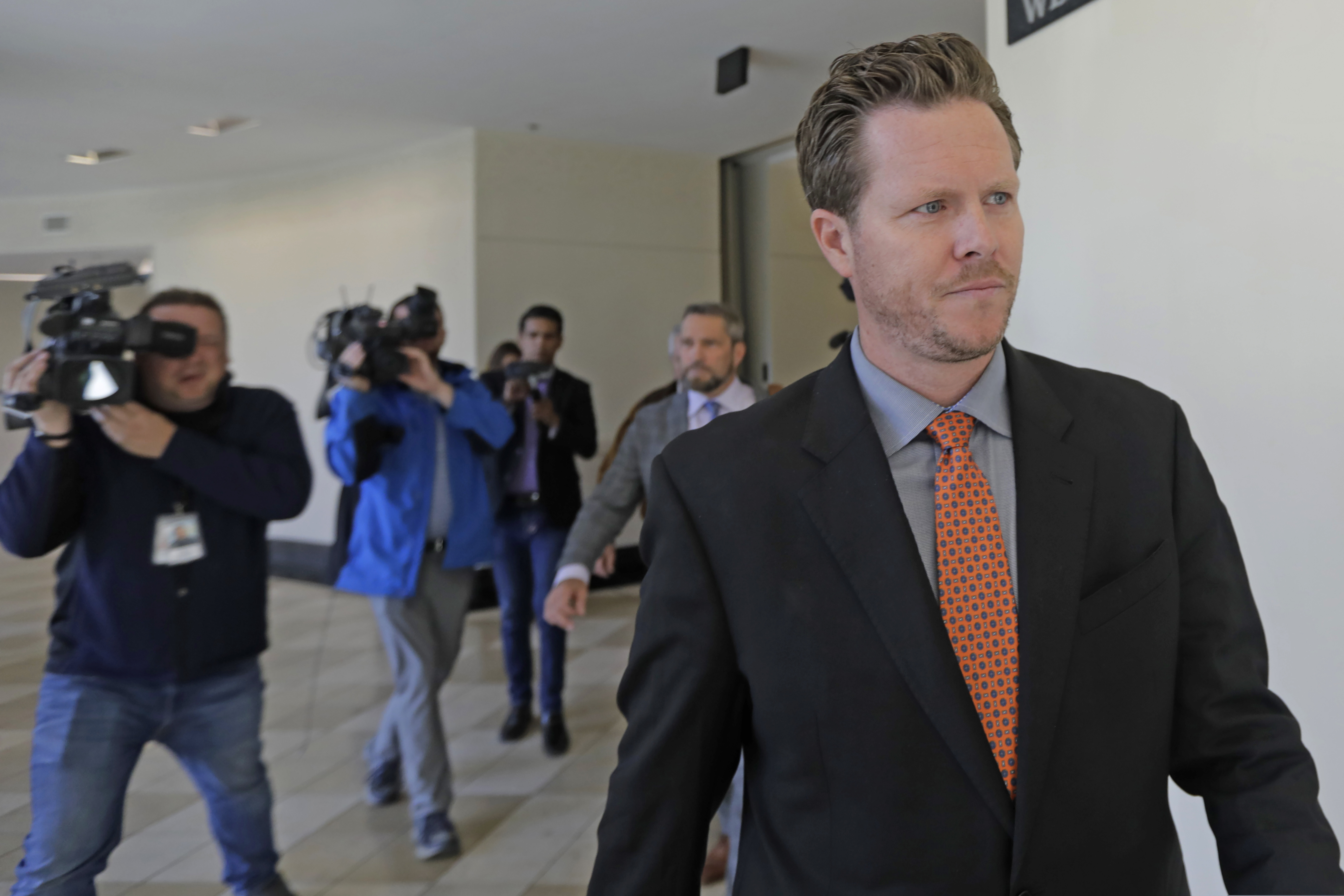 (Rick Bowmer | AP file) Paul Petersen, an Arizona elected official accused of running a multi-state adoption scheme, leaves court after an initial appearance on charges filed in the state in Salt Lake City on Nov. 15, 2019.