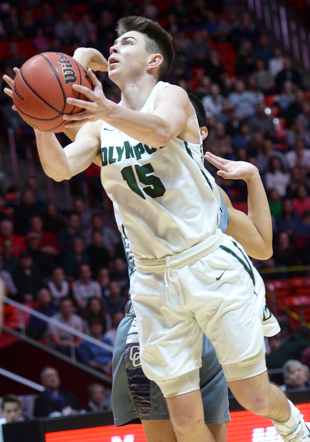 (Leah Hogsten  |  The Salt Lake Tribune) Olympus' Rylan Jones (15) aims for the net. Olympus plays Corner Canyon for the 5A High School BoysÕ Basketball Tournament Championship at the Jon M. Huntsman Center in Salt Lake City,  Saturday, March 3, 2018.