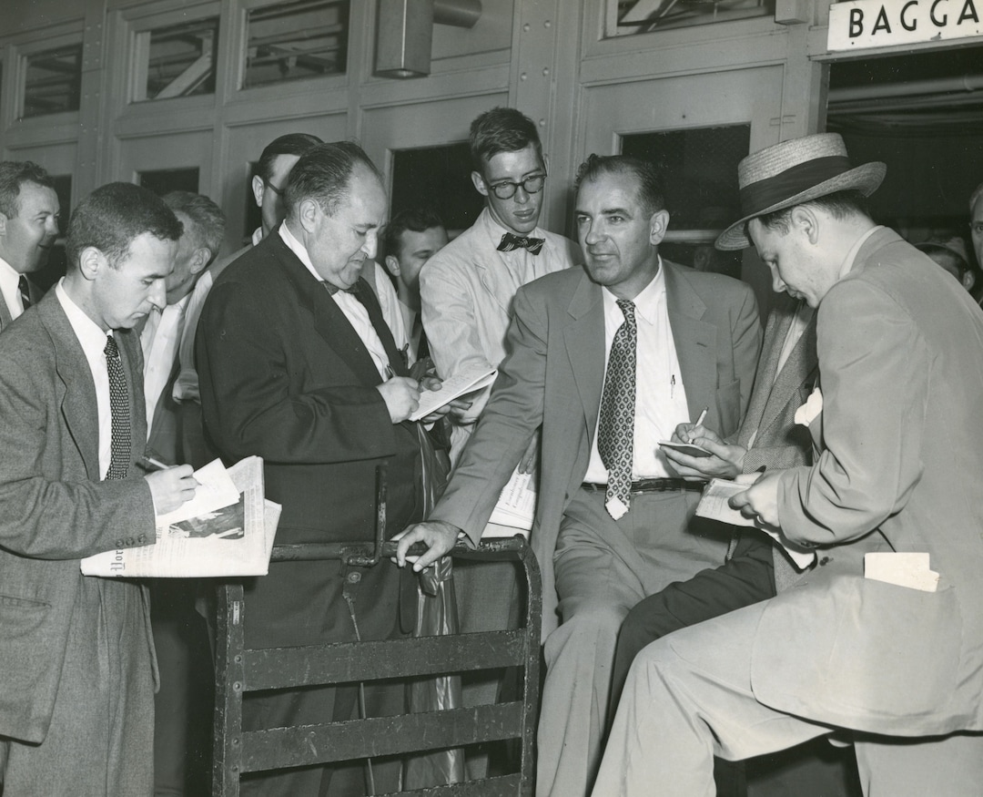 (Photo courtesy of the Wisconsin Historical Society) Sen. Joseph McCarthy speaks with reporters at LaGuardia Airport shortly after his victory in the 1952 Wisconsin Republican primary.