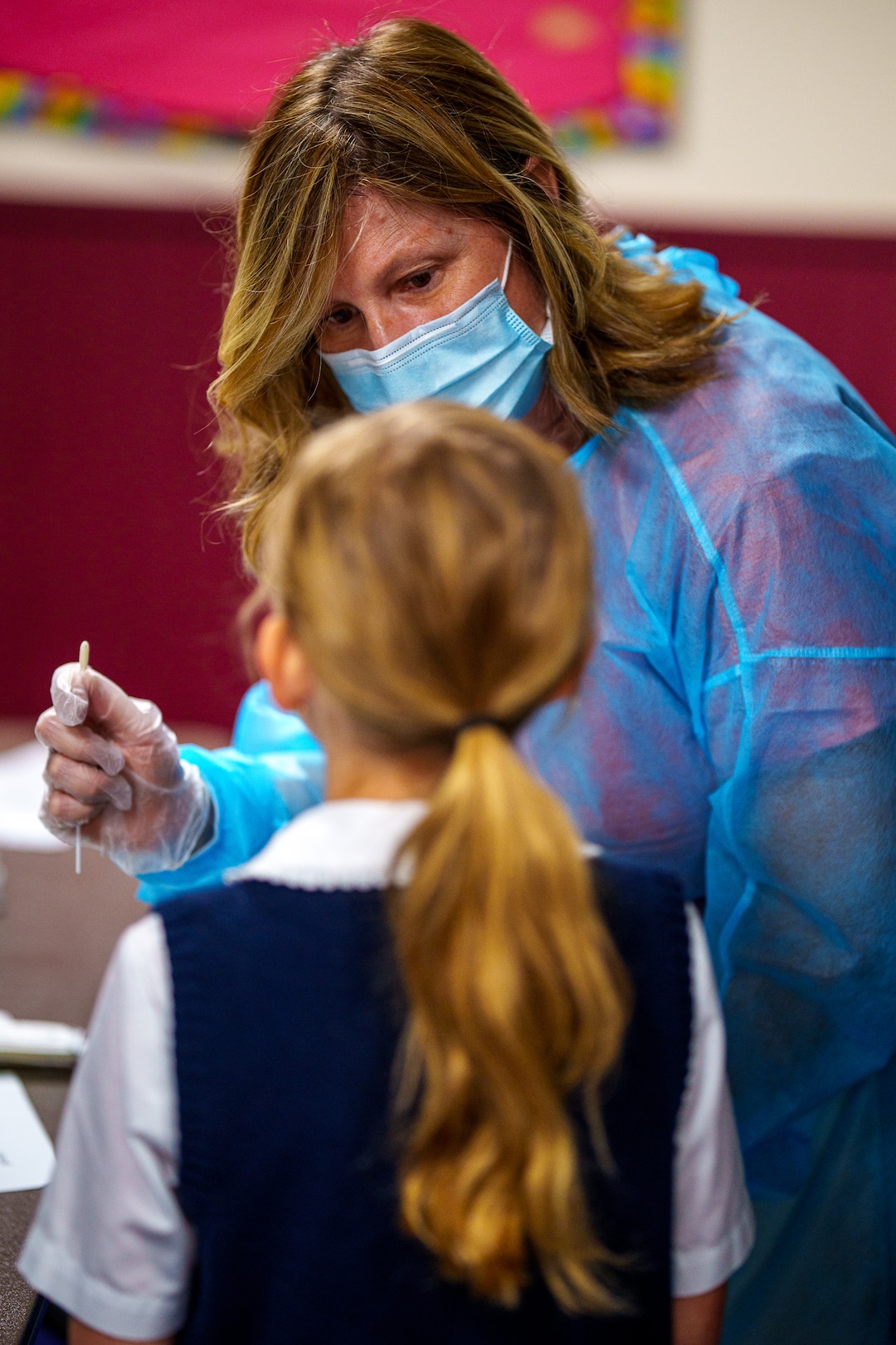 (Trent Nelson  |  The Salt Lake Tribune) Jen Avery tests a student for COVID-19 at American Preparatory Academy in Draper on Tuesday, Sept. 14, 2021.