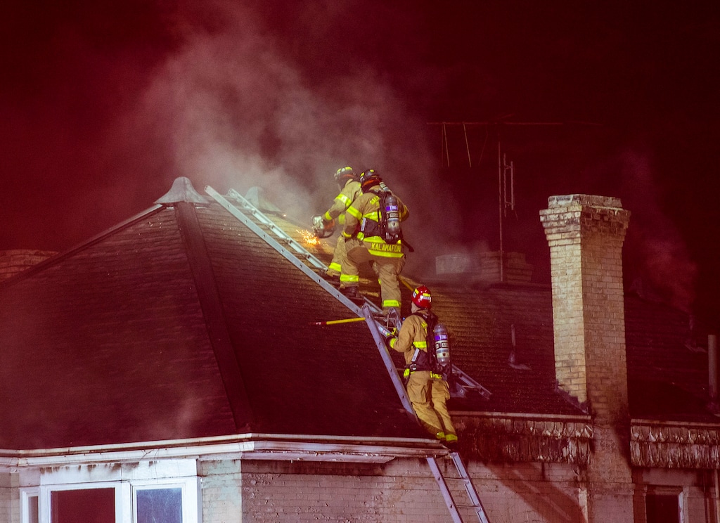 (Rick Egan  |  The Salt Lake Tribune)   Salt Lake City Fire crews work on a fire on South Temple between State Street ad 200 East, on Friday, July 3, 2020.