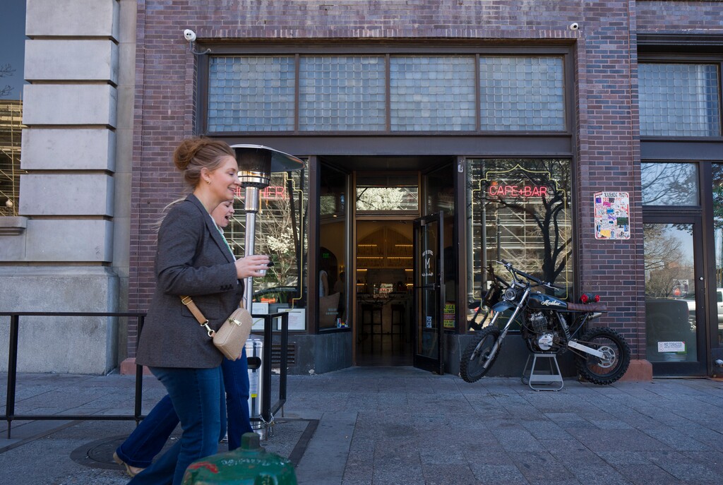 (Bethany Baker  |  The Salt Lake Tribune) People walk in front of Mother Cafe & Bar in Salt Lake City on Friday, March 20, 2026.