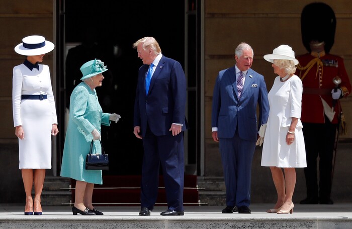 Britain's Queen Elizabeth II greets President Donald Trump, center, and first lady Melania Trump, left, with Britain's Prince Charles and Camilla, Duchess of Cornwall during a ceremonial welcome in the garden of Buckingham Palace in London, Monday, June 3, 2019 on the opening day of a three day state visit to Britain. (AP Photo/Frank Augstein)