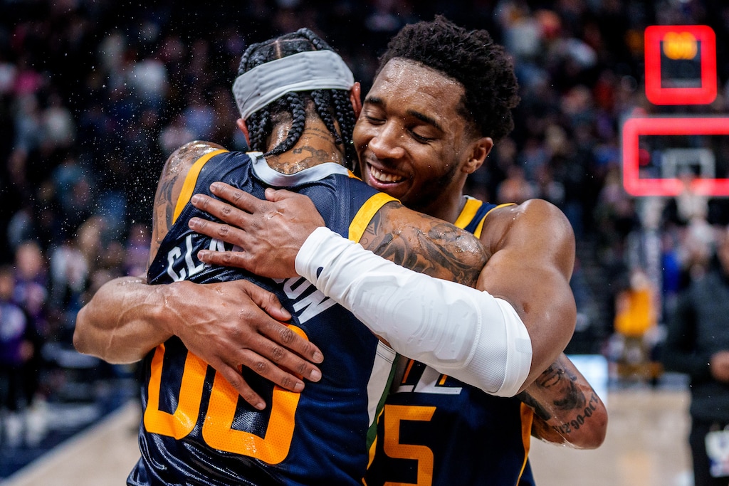 (Trent Nelson | The Salt Lake Tribune) Utah Jazz guard Jordan Clarkson (00) embraces Utah Jazz guard Donovan Mitchell (45) as the Utah Jazz host the Sacramento Kings, NBA basketball in Salt Lake City on Saturday, March 12, 2022. Clarkson finished with a career-high 45 points.