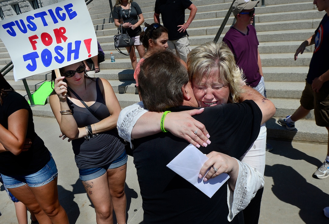 Scott Sommerdorf   |  The Salt Lake Tribune  Josh Holt's mother Laurie Holt hugs her uncle Leonard Bell after a rally on the east steps of the Utah State Capitol that called for the release of their 24-year-old son Josh Holt, who is currently jailed in Venezuela, Saturday, July 30, 2016. 