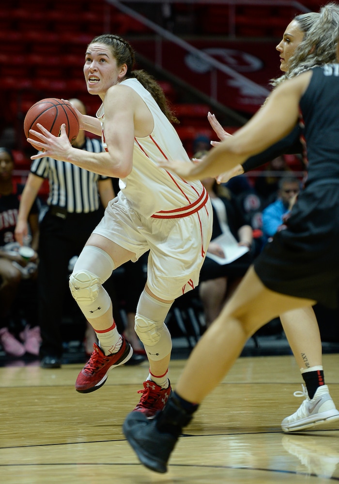 (Francisco Kjolseth  |  The Salt Lake Tribune)  Utah Utes center Megan Huff (5) drives the ball as Utah hosts UNLV in women's NCAA basketball at the Huntsman Center, Thursday, March 15, 2018.
