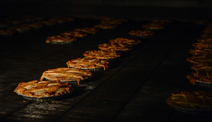 Francisco Kjolseth | The Salt Lake Tribune
Hand laid lattice apple pie roll through the ovens at Rocky Mountain Pie factory in Salt Lake recently. Eight different pies sold through Associated Food Stores earned blue ribbons in the commercial categories at the National Pie Championships.