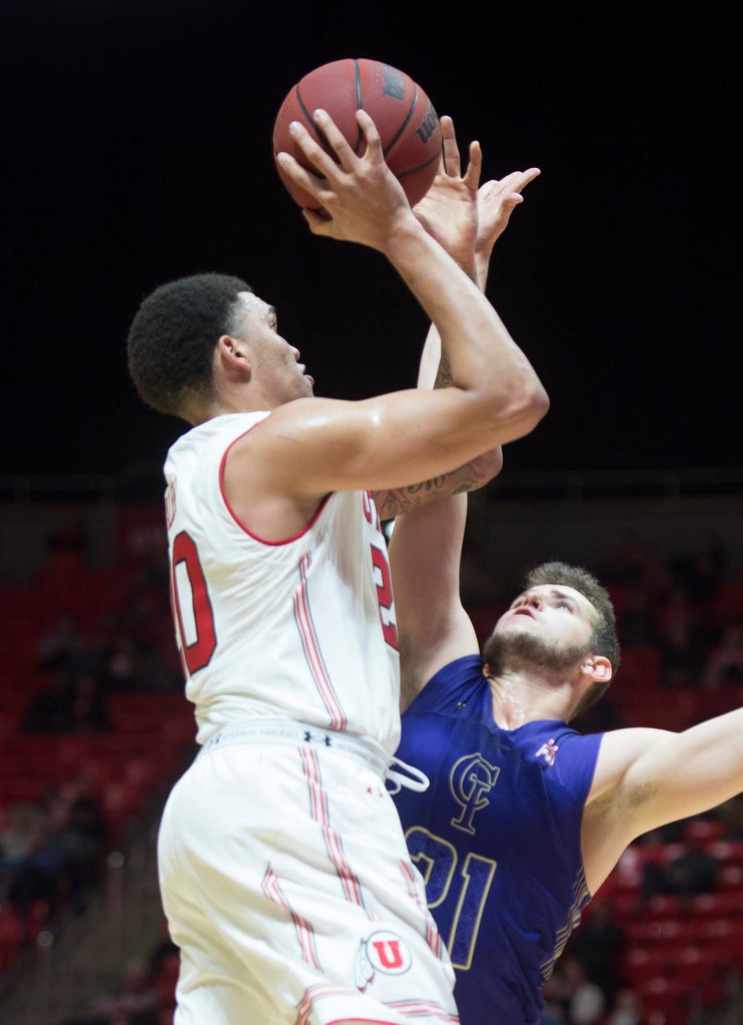 (Rick Egan  |  The Salt Lake Tribune)    Utah Utes forward Timmy Allen (20) shoots, as College of Idaho forward Connor Desaulniers (21) defends, in basketball action, between the Utah Utes and the College of Idaho Yotes at the Jon M. Huntsman Center, Thursday, Nov. 1, 2018.