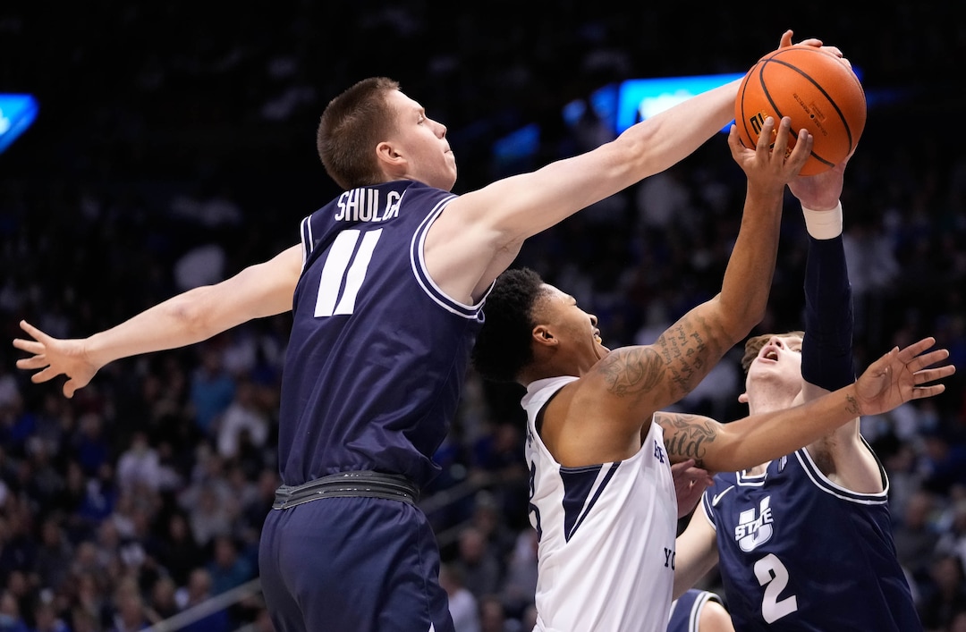 (Francisco Kjolseth | The Salt Lake Tribune) Utah State Aggies guard Max Shulga (11) reaches in on the ball along with Brigham Young Cougars guard Te'Jon Lucas (3) and Utah State Aggies guard Sean Bairstow (2) in basketball action between the Brigham Young Cougars and the Utah State Aggies at the Marriott Center in Provo, Wednesday, Dec. 8, 2021.