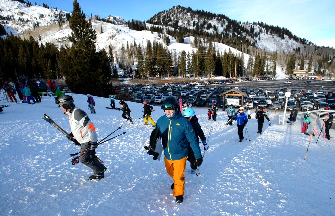(Steve Griffin  |  The Salt Lake Tribune) Skiers and snowboarders head up the hill to the lifts at Brighton ski area in Salt Lake City Monday January 1, 2018.