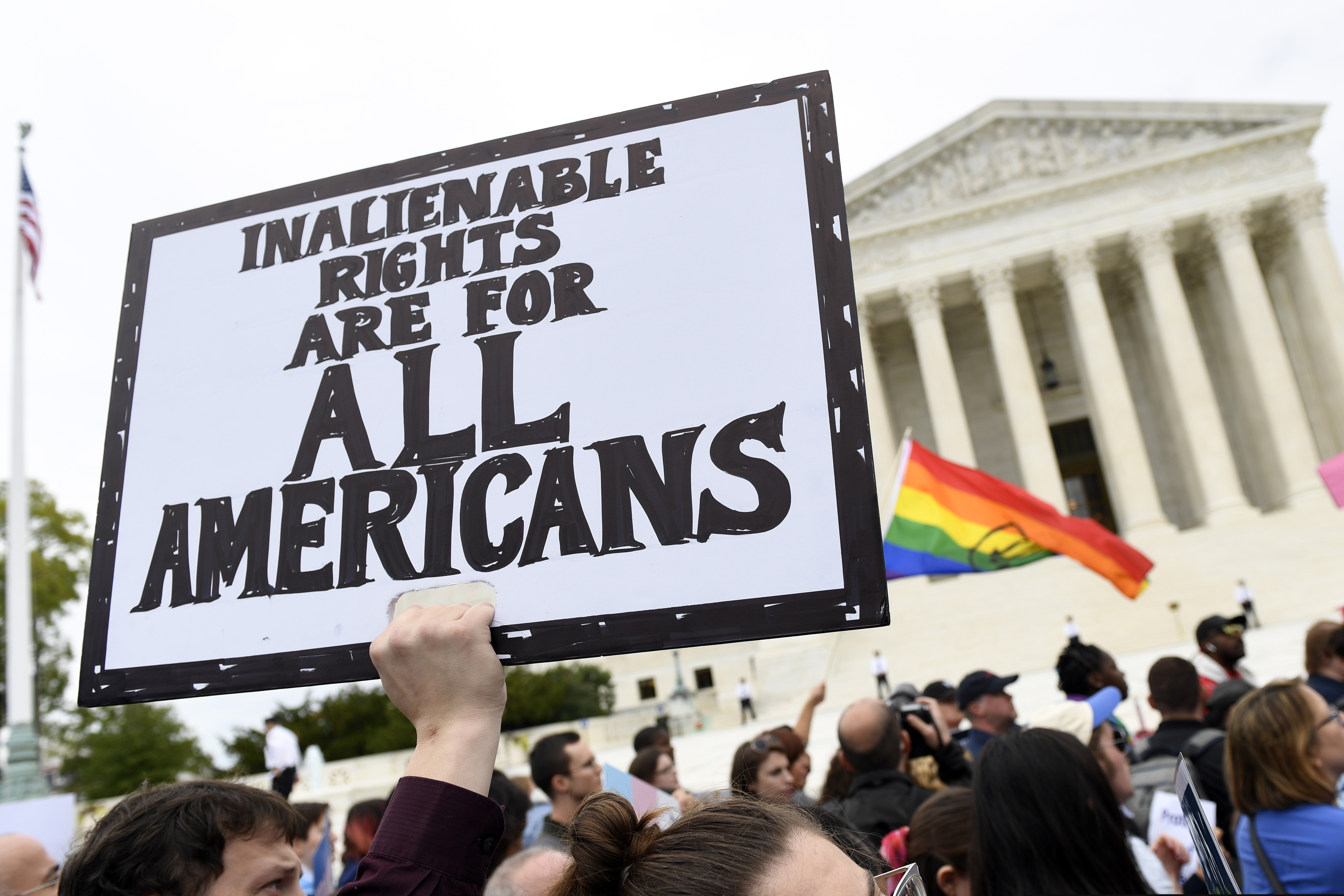 (Susan Walsh | AP file photo) In Oct. 8, 2019, protesters gather outside the Supreme Court in Washington where the Supreme Court is hearing arguments in the first case of LGBT rights since the retirement of Supreme Court Justice Anthony Kennedy. As vice president in 2012, Joe Biden endeared himself to many LGBTQ Americans by endorsing same-sex marriage even before his boss, President Barack Obama. Now, as president-elect, Biden is making sweeping promises to LGBTQ activists, proposing to carry out virtually every major proposal on their wish lists.