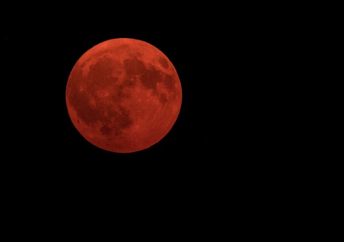(Leah Hogsten  |  The Salt Lake Tribune) The September 5, 2017 full moon, known as the Corn Moon, rises over like a ball of fire above Weber Canyon, red from smoke in the air. The Uintah fire is still burning through the town of Uintah and pockets of South Weber, as well as the unincorporated subdivision of Uintah Highlands. It has burned over 1,200 acres and is 0% contained. 