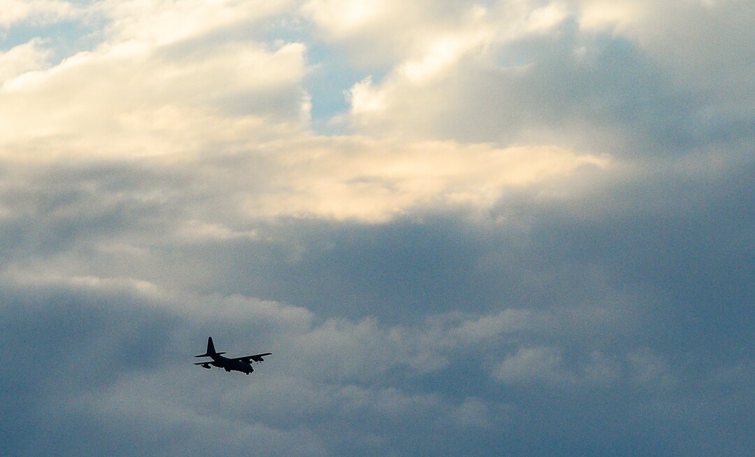 (Francisco Kjolseth  |  The Salt Lake Tribune)  A C-130 arrives in the Salt Lake valley with the body of Utah firefighter Matt Burchett, 42, who died fighting a wildfire in California. He was being returned home, arriving at the Utah Air National Guard in Salt Lake City on Wed. Aug. 15, 2018. The remains of the Draper battalion chief were later transported to Jenkins-Soffe Mortuary in South Jordan.