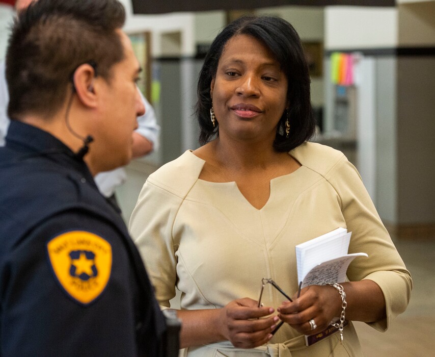 (Rick Egan | The Salt Lake Tribune) Rep. Sandra Hollins, D-Salt Lake City, talks to a police officer at West High in this 2019 file photo. She is running a bill in the 2021 legislative session to add training for and address other concerns with school resource officers.