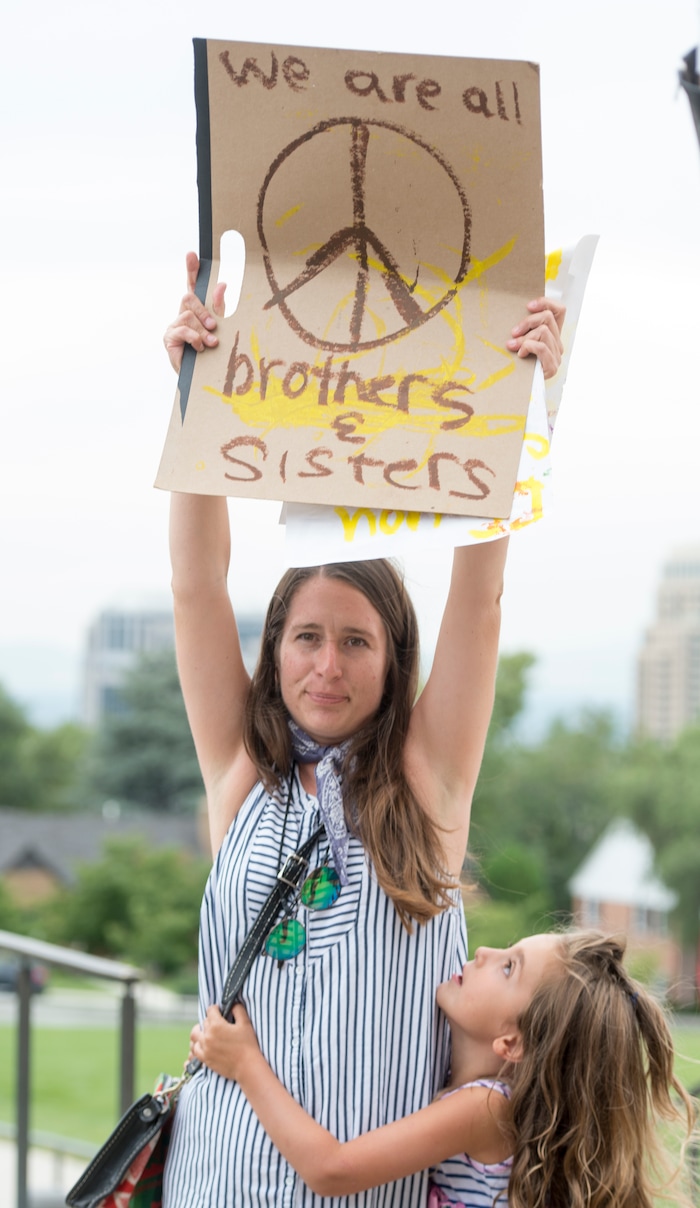 (Rick Egan  |  The Salt Lake Tribune)   Mia  Jessica Eichcauer and 5-year-old Fiona Hatch, at the "One Utah" Rally for Unity at the State Capitol, Monday, August 14, 2017.


