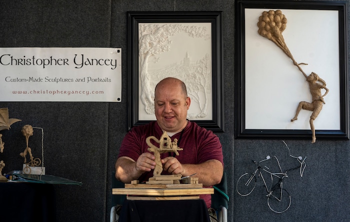 (Rick Egan | The Salt Lake Tribune) Christopher Yancey works on a sculpture, at the Salt Lake Arts Festival, on Saturday, Aug. 28, 2021.