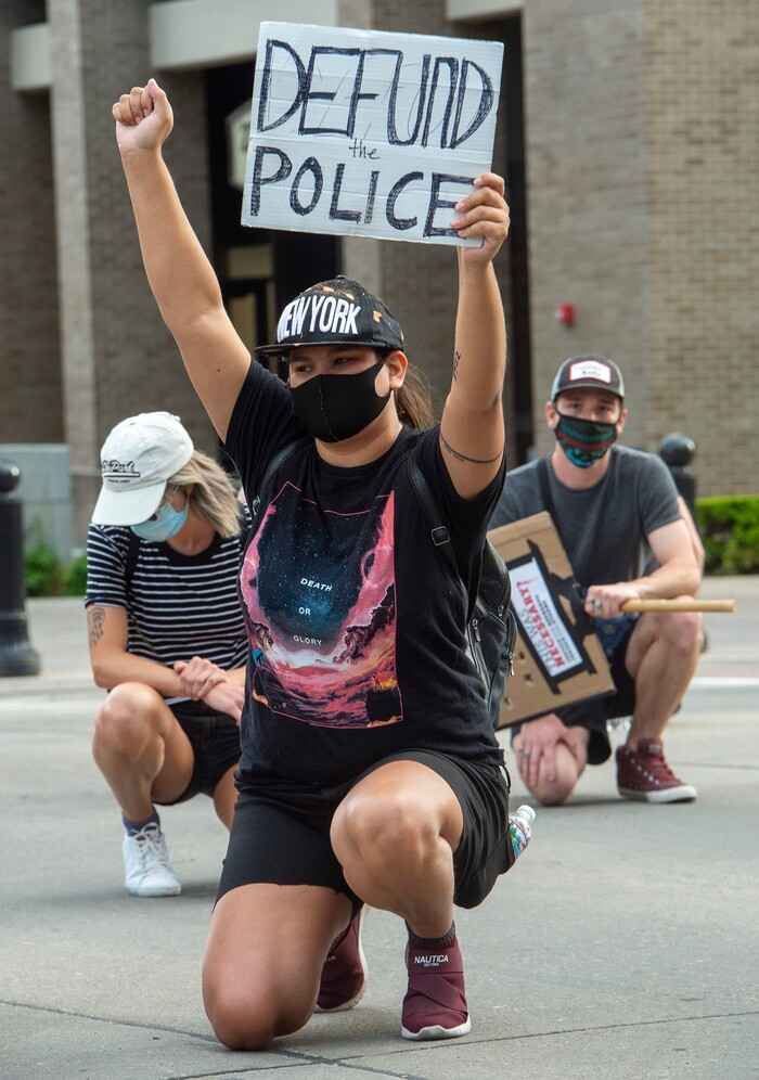 (Rick Egan  |  The Salt Lake Tribune)     A protester named Cim takes a knee during in a moment of silence for Bernardo, during a Justice for Bernardo rally in the streets of Salt Lake City on Thursday, June 25, 2020.