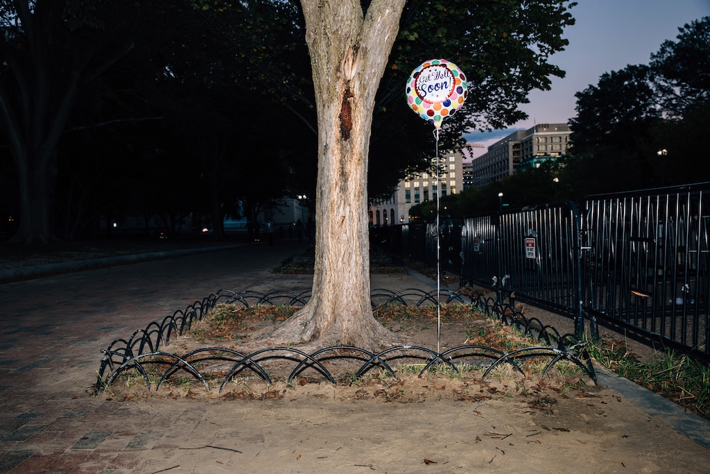 (Damon Winter | The New York Times)
A balloon is left for President Donald Trump outside of the White House in Washington, Oct. 2, 2020. "Let us all wish Donald Trump a full and speedy recovery from his bout of Covid-19," writes New York Times columnist Bret Stephens. "We wish him well because, even, or especially, in our hyperpolitical age, some things must be beyond politics."
