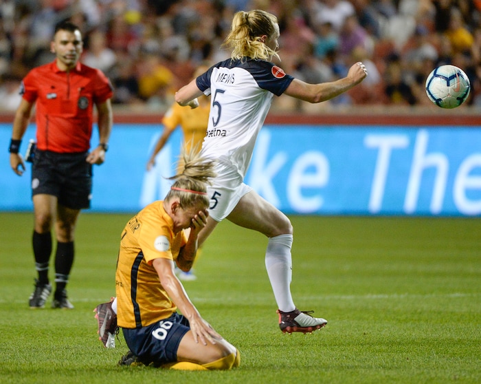 (Francisco Kjolseth  |  The Salt Lake Tribune)  Utah Royals FC midfielder Gunnhildur Jnsdttir (66) gets kicked in the face by North Carolina Courage midfielder Samantha Mewis (5) as Utah Royals FC hosts the North Carolina Courage at Rio Tinto Stadium in Sandy, Utah on Saturday, July 27, 2019.