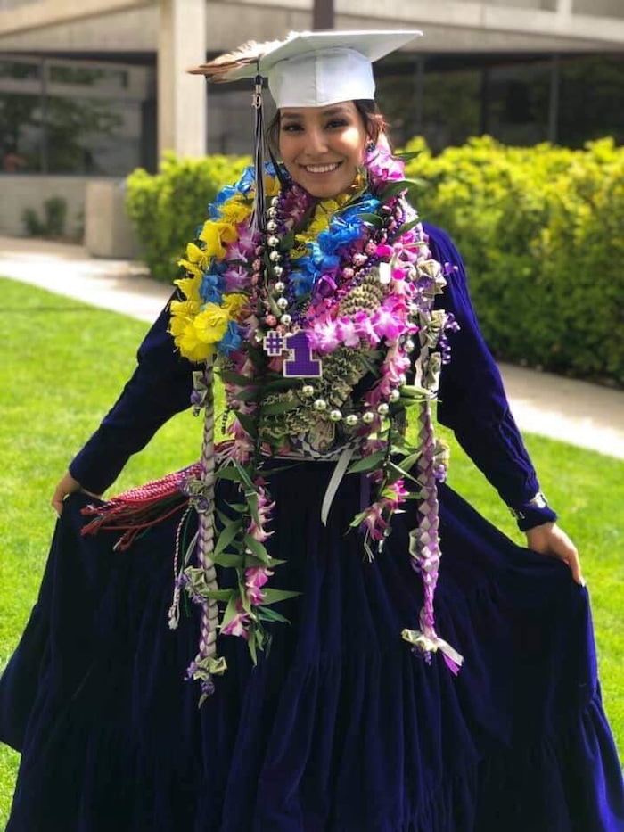 (Photo courtesy of Tasheena Savala) Pictured is Tasheena Savala with leis and decorations added after her graduation ceremony on May 29, 2019.