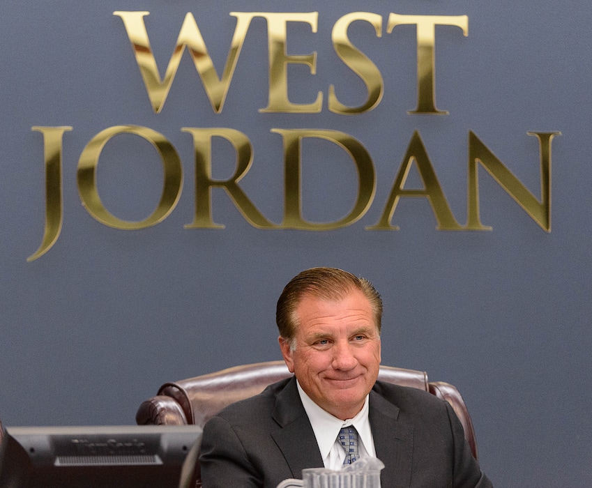 (Trent Nelson | Tribune file photo) West Jordan Mayor Kim Rolfe sits at the podium under the city logo. Rolfe was a supporter of changing to a strong mayor form of government and that initiative was approved by voters. But Rolfe was defeated in his bid for re-election.